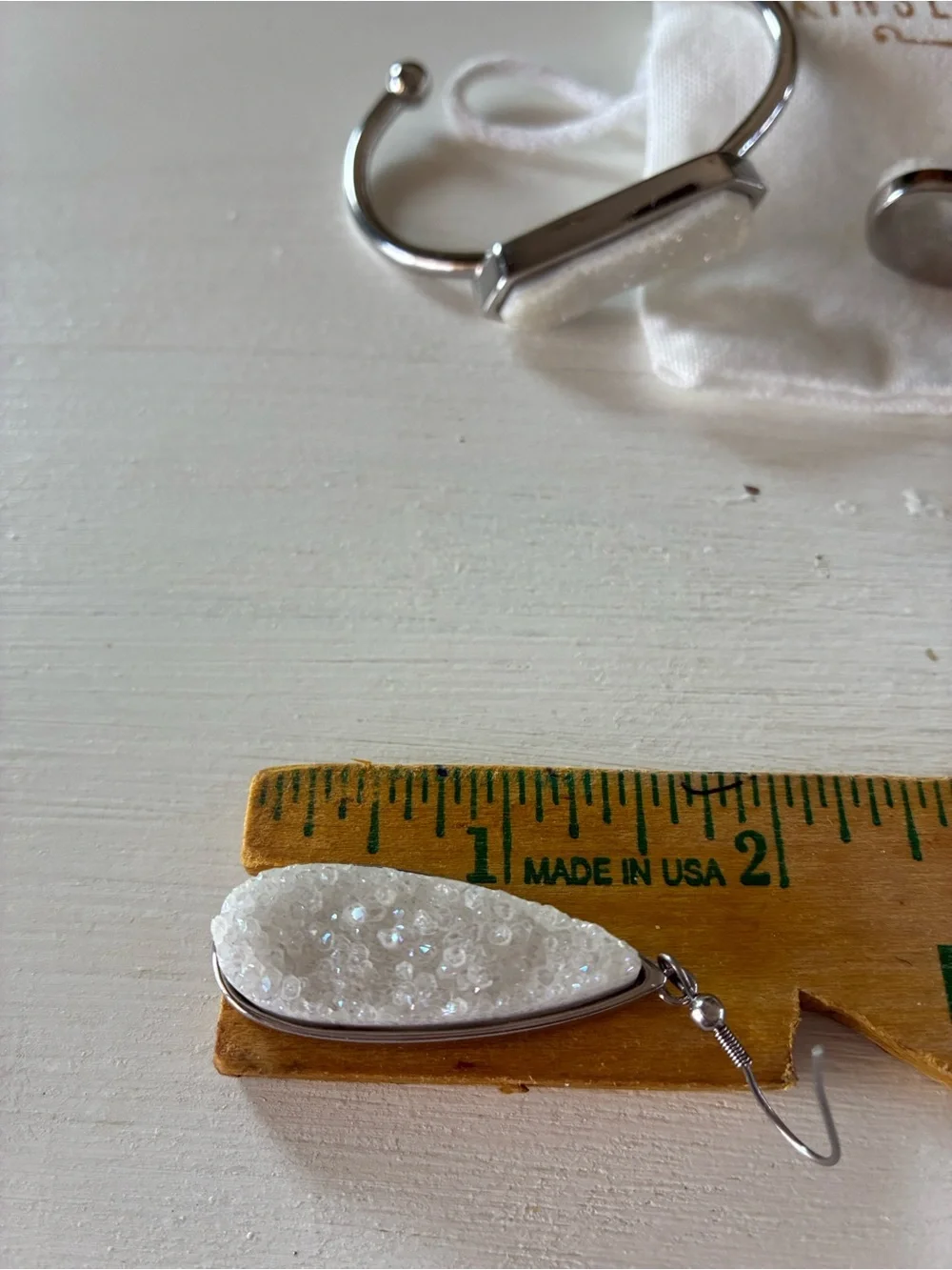 Kinsley Armelle White Druzy Teardrop Earrings and matching silver tone bracelet